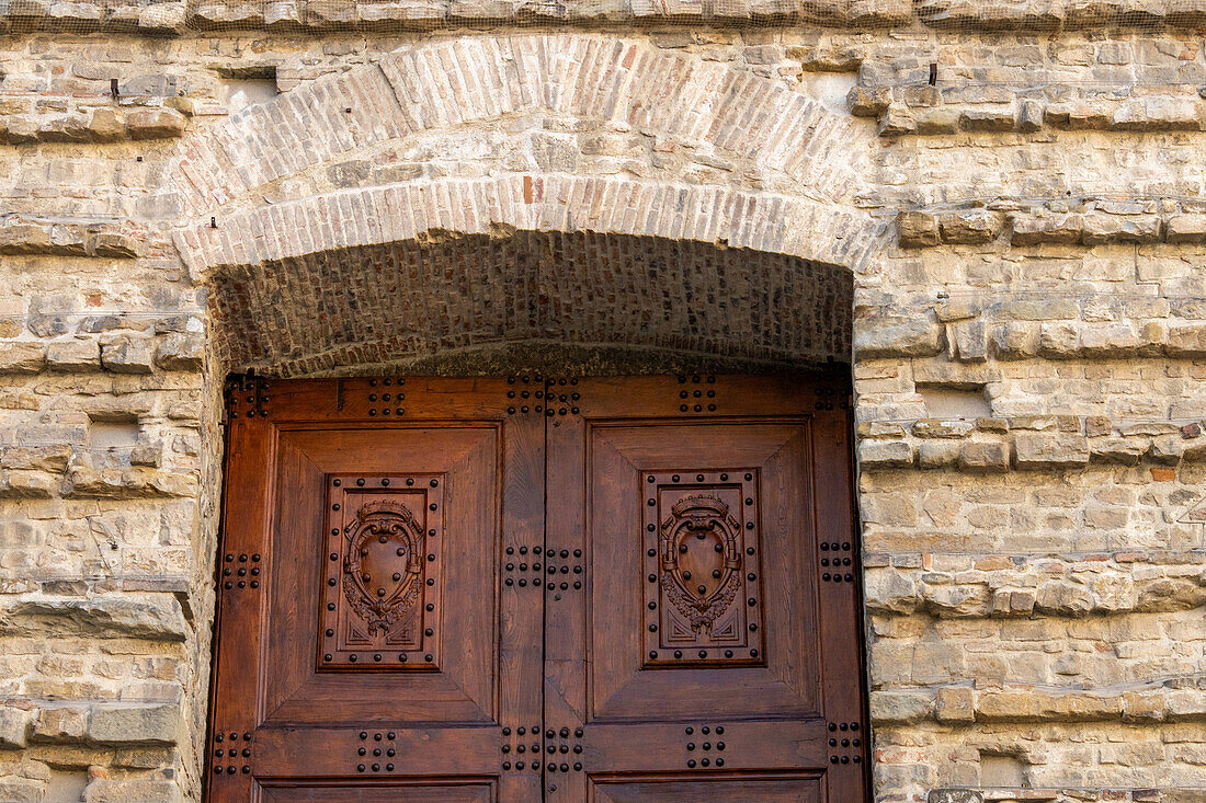 Detail of the carved wooden door into the medieval Basilica di San Lorenzo in Florence, Italy.