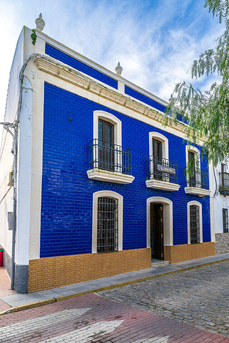 Traditional house with Portuguese-influenced colorful tiles in a picturesque Spanish neighborhood