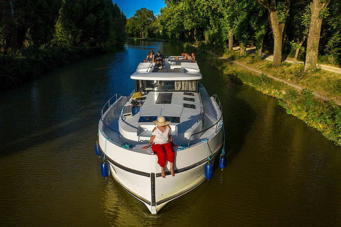 Aerial view of a nice landscape in the Canal du Midi near L'écluse de Marseillette South of France southern waterway waterways holidaymakers queue for a boat trip on the river, France, Europe