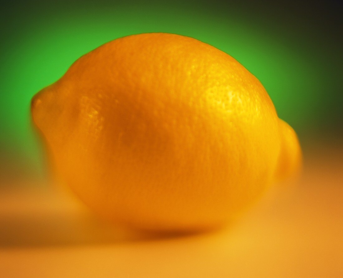 A Lemon on a Green and Yellow Background
