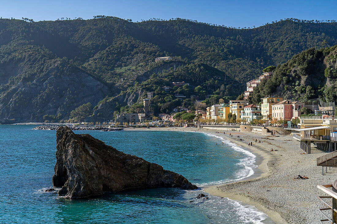 The Fegina beach in off peak season in Monterosso al Mare, Cinque Terre, Italy, with the Scoglio Malpasso or Malpasso Rock.