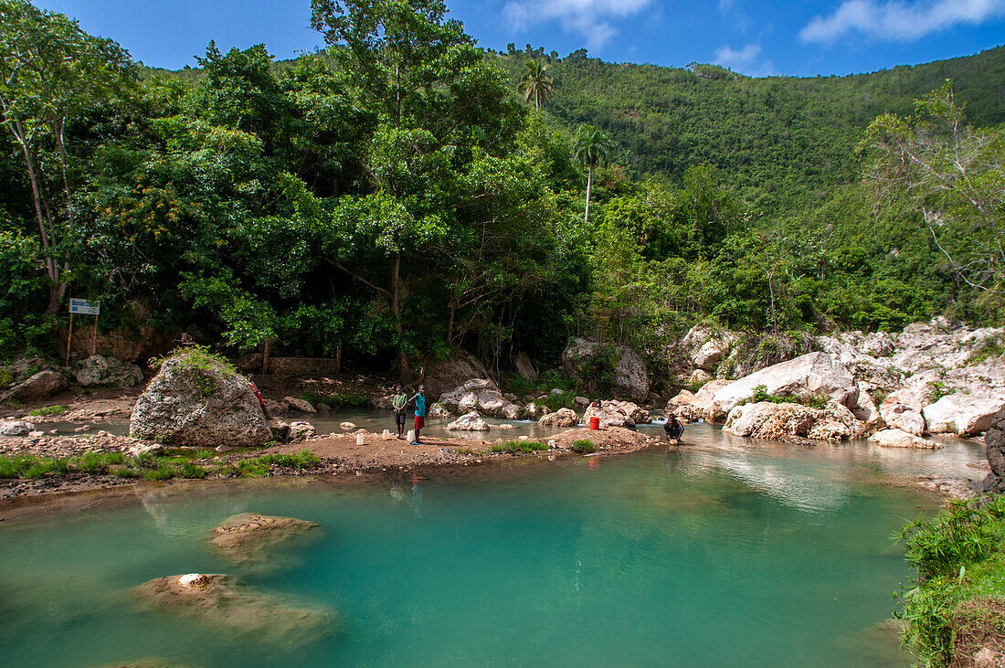 Exploring the cobalt waters of Bassin Bleu waterfall composed of bassin yes, bassin palmiste and bassin clair, Maire de Jacmel, Jacmel, Haiti