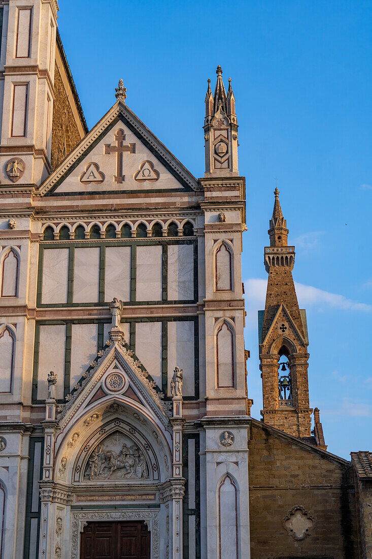 The facade and campanile of the Basilica of Santa Croce or Basilica of the Holy Cross in Florence, Italy.