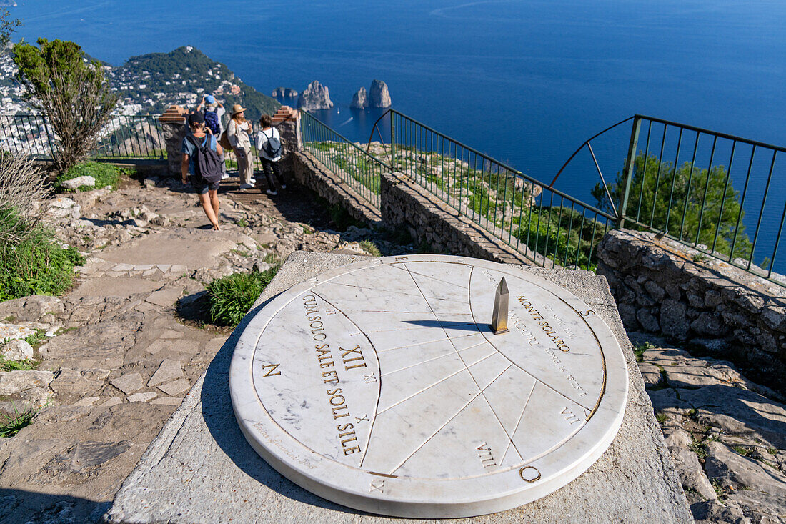 A sundial at the overlook on Monte Solaro on the island of Capri, Italy. The Farallon Islands are visible behind.