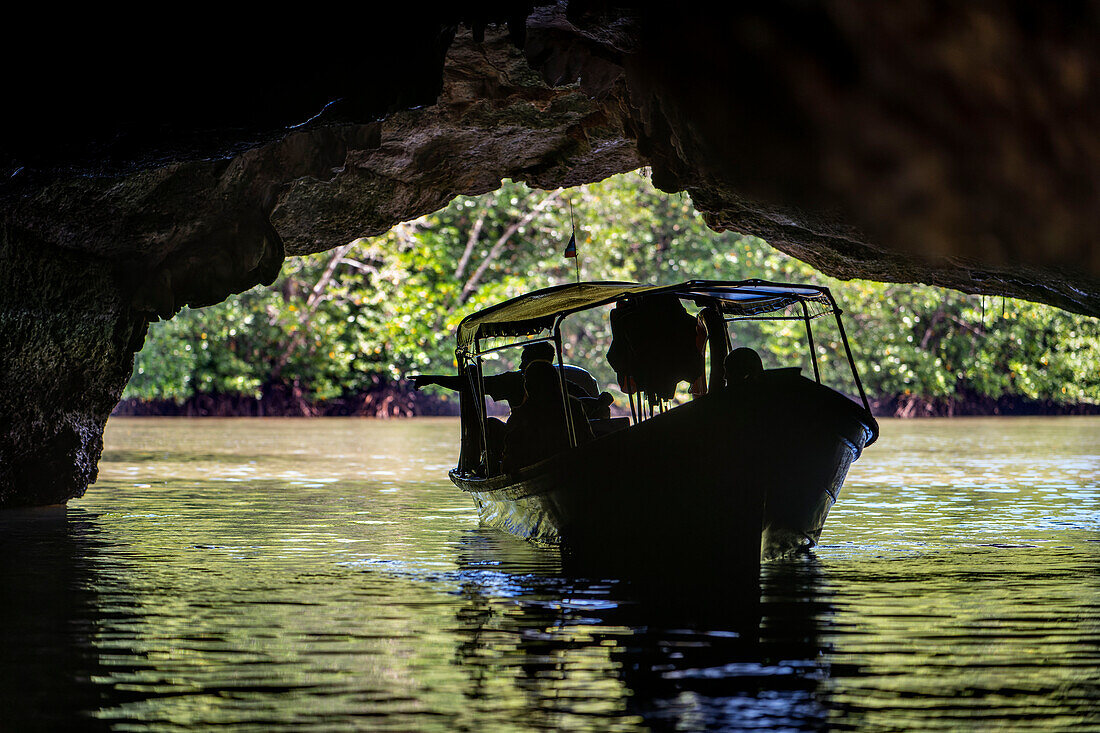 Boat trip at the Kilim Geoforest Park Jetty. Tourist boat starts their journey throw the mangrove forest. Island most exquisite and geologically significant landscapes