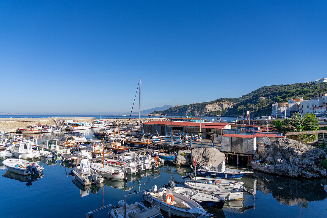 Boats in the Marina Grande in Sorrento, Italy. Mount Vesuvius is visible on the horizon.