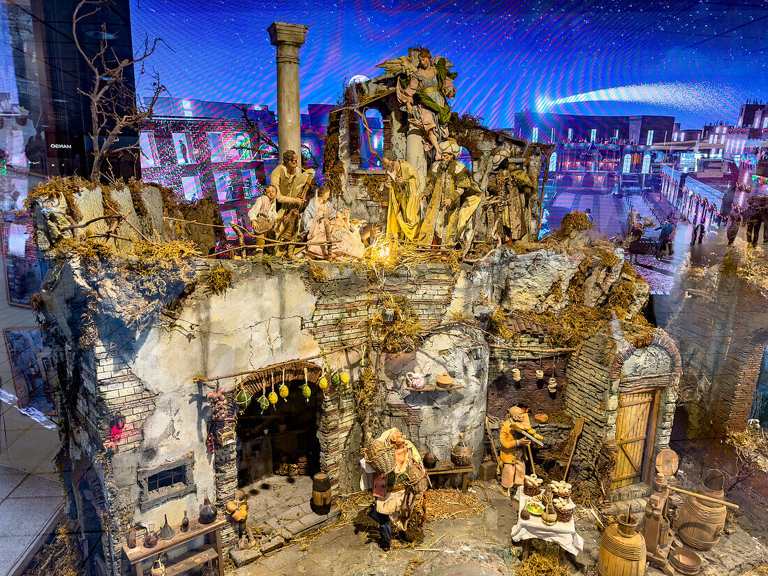 An elaborate traditional presepe or Neapolitan nativity scene on display in the Central Railway Station in Naples, Italy.