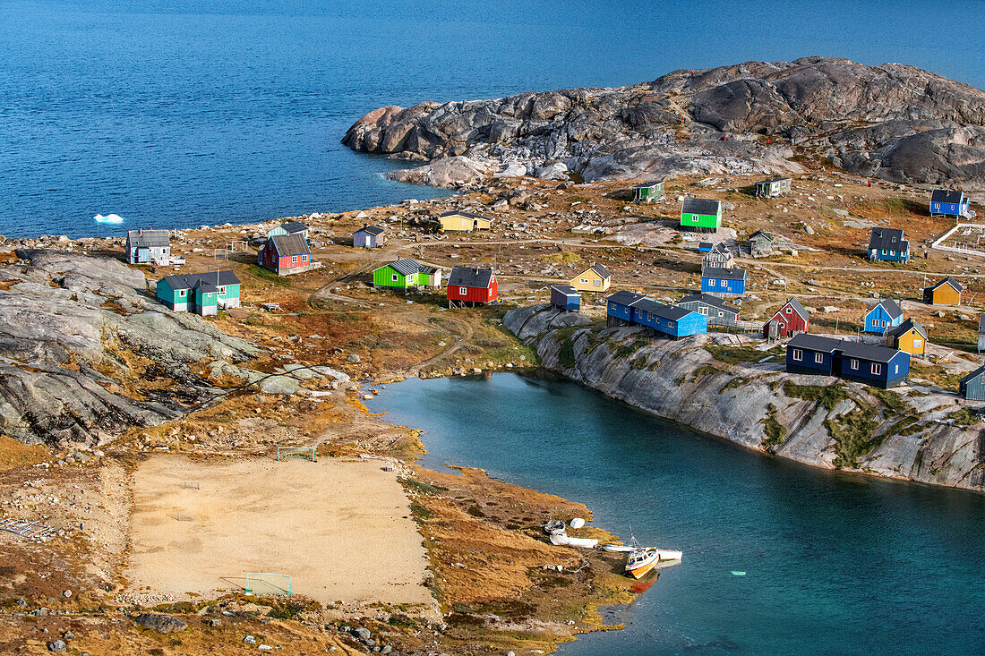 Coloful houses in the small isolated inuit village of Aappilattoq, South Greenland, Arctic sea.