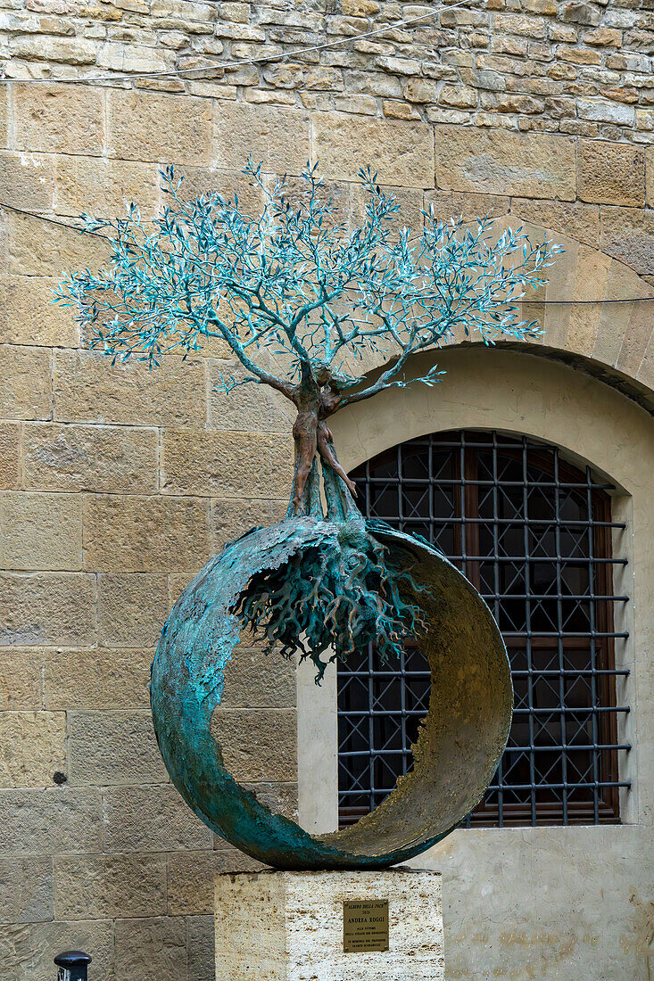 The Tree of Life, a bronze sculpture by Andrea Roggi, on a street in Florence, Italy, outside the back of the Uffizi Gallery.