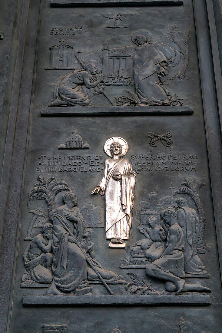 Detail of the bronze door of the main portal of the Basilica of St. Paul Outside the Walls, Rome, Italy.