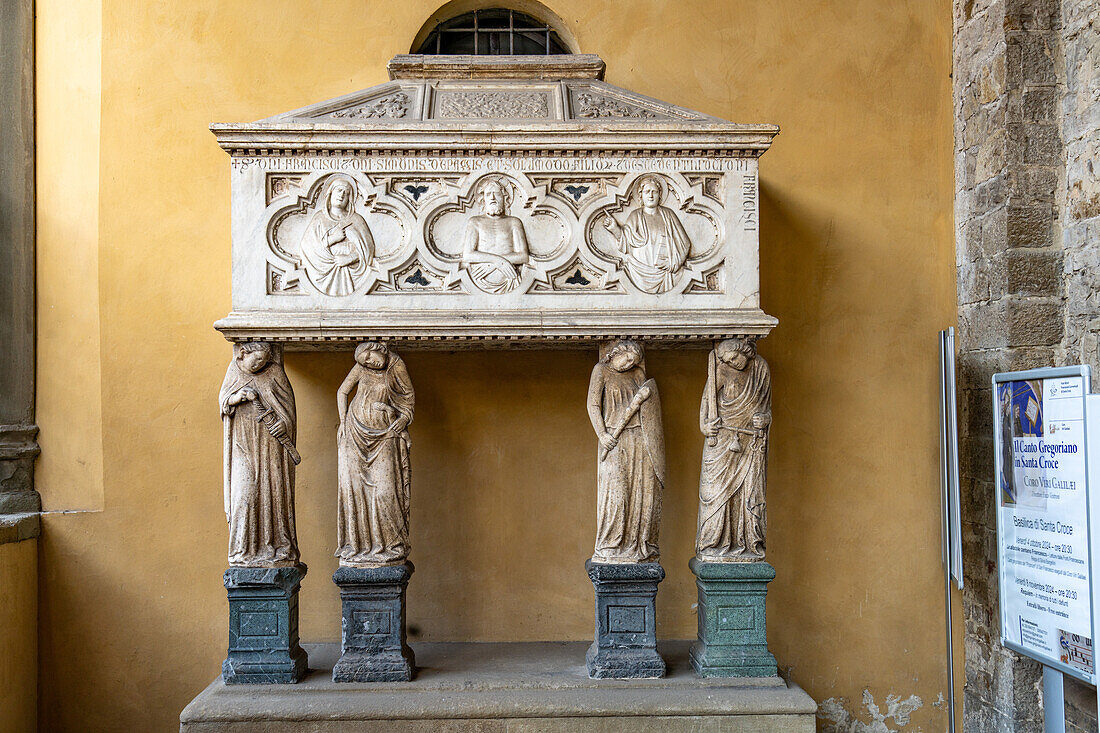 The tomb of Francesco Pazzi outside the entrance to the Basilica of Santa Croce, Florence, Italy.