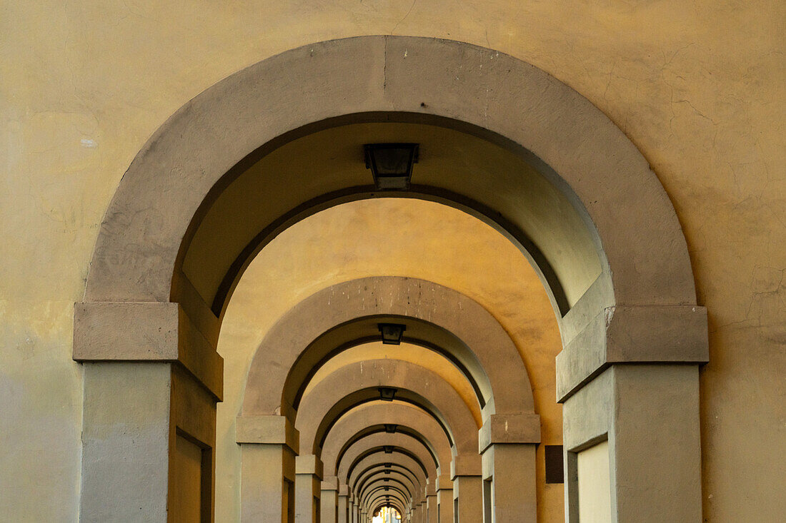 Abstract composition of the arches supporting the Vasari Corridor by the Ponte Vecchio in Florence, Italy.