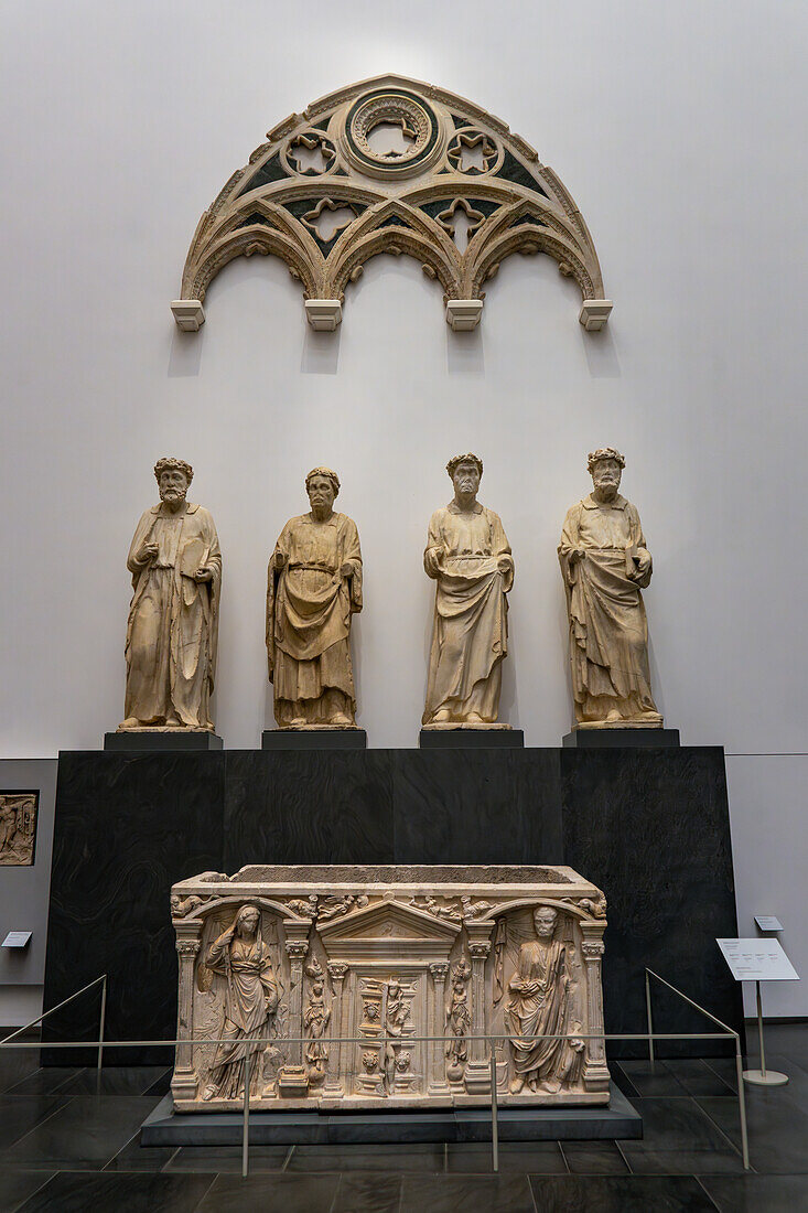 Statues by Piero di Giovanni Tedesco & Niccolo di Pietro Lamberti in the Duomo Museum in Florence, Italy. Circa 1395-1401 A.D. In front is a 2nd Century Roman sarcophagus.