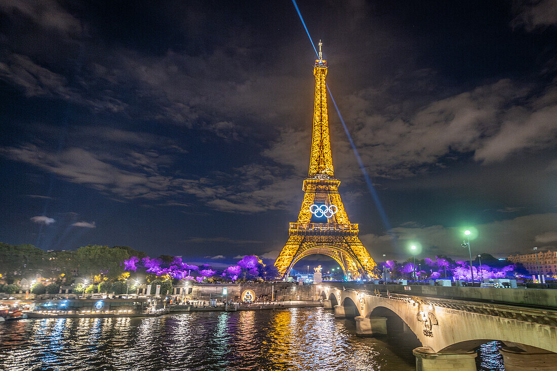 Eiffel Tower with Olympic rings at night, Paris, France