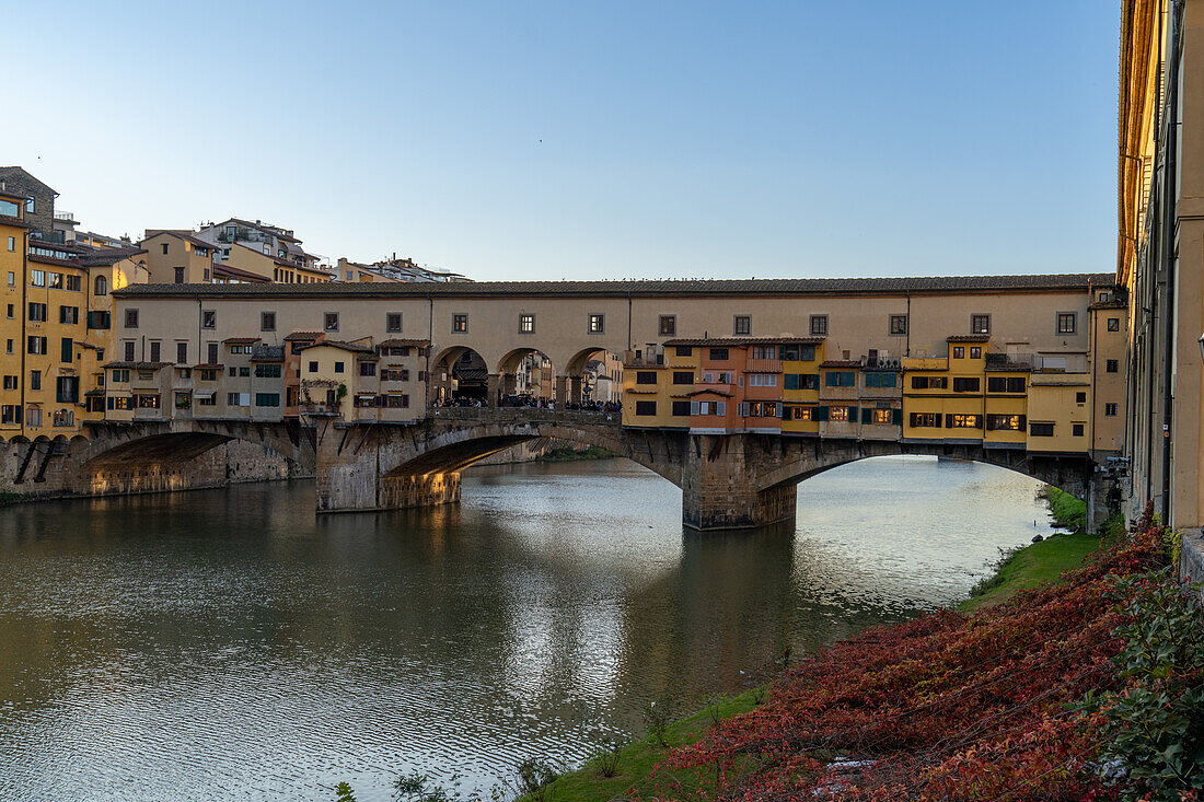 The Ponte Vecchio, a medieval stone arch bridge over the Arno in Florence, Italy.