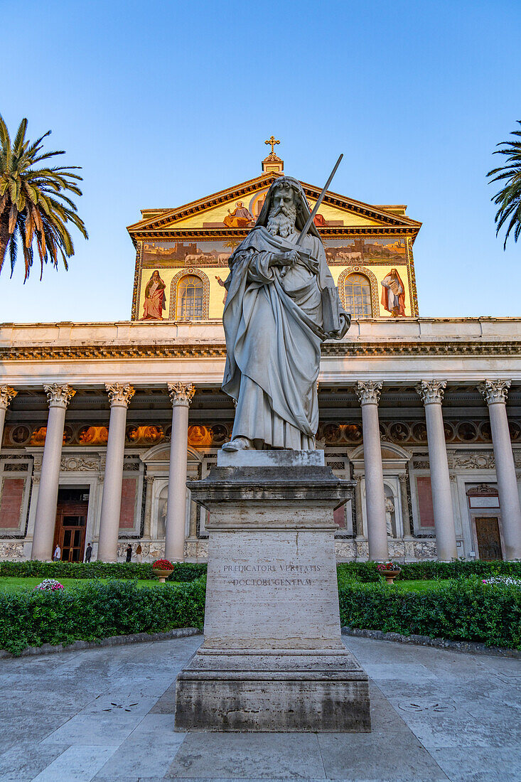 The statue of St. Paul and facade of the Basilica of St. Paul Outside the Walls, Rome, Italy.