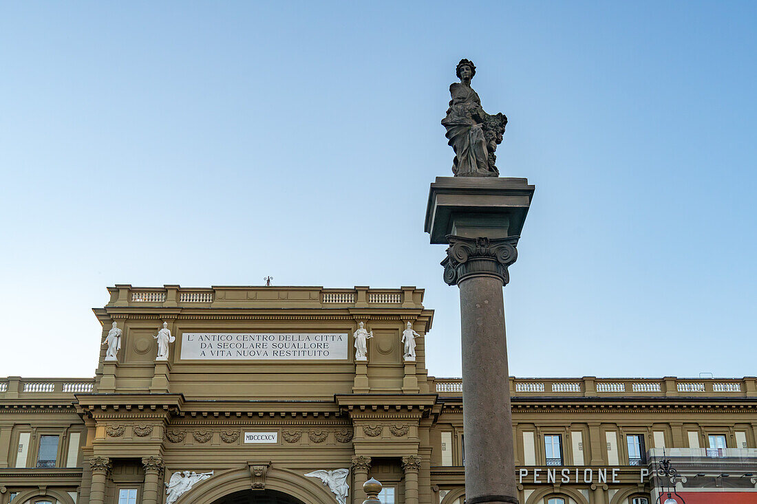 The Column of Abundance in the Piazza della Repubblica or Republic Square in Florence, Italy. Behind is the Palazzo dell'Arcone di Piazza.