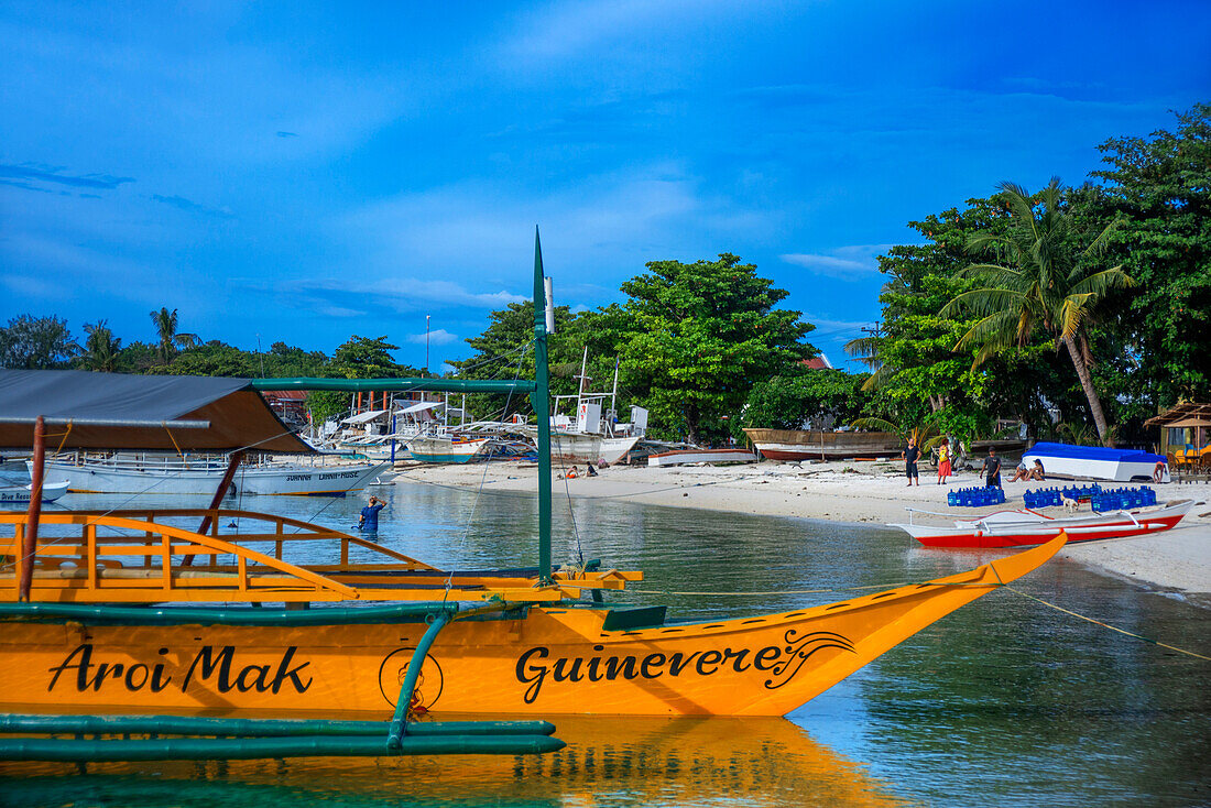 Traditional boats moored in Logon beach, Malapascua island, Cebu, Philippines