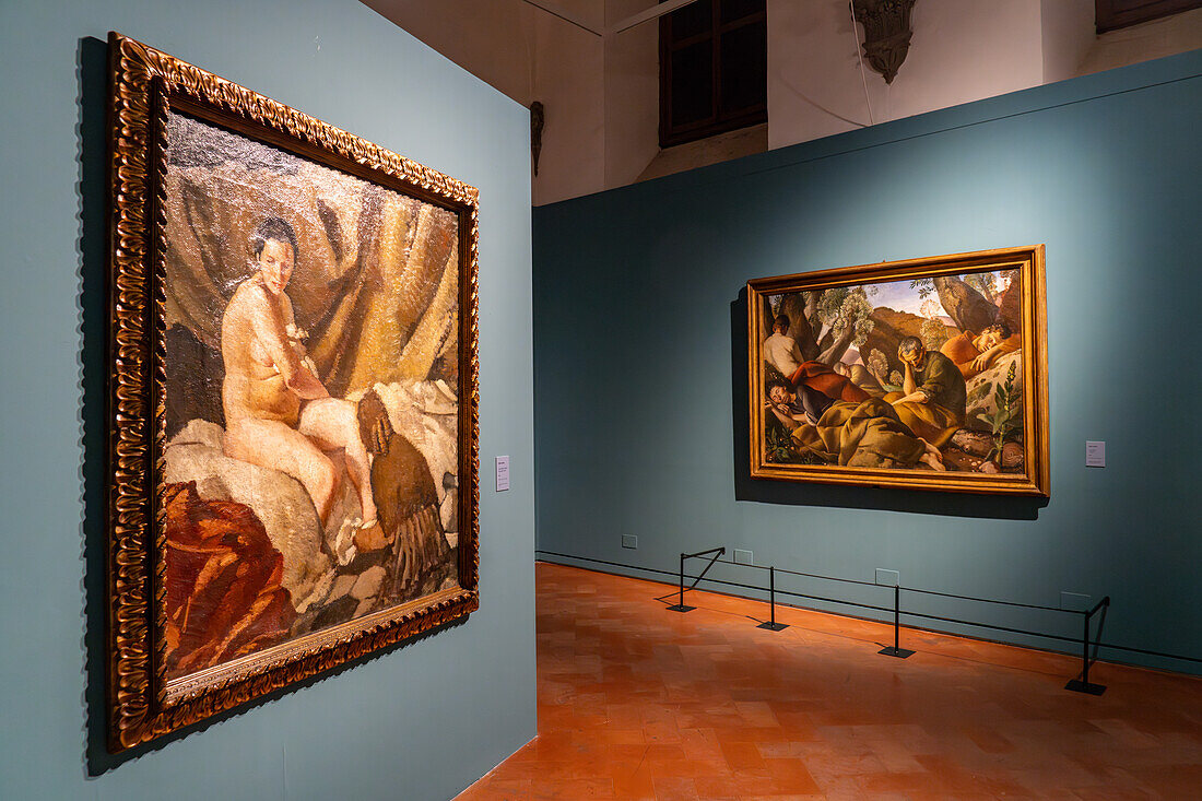 Paintings by artist Felice Carena in a gallery in the Palazzo Medici Riccardi, Florence, Italy. At left is Susanna (After the Bath), circa 1924, and The Apostles, circa 1926.