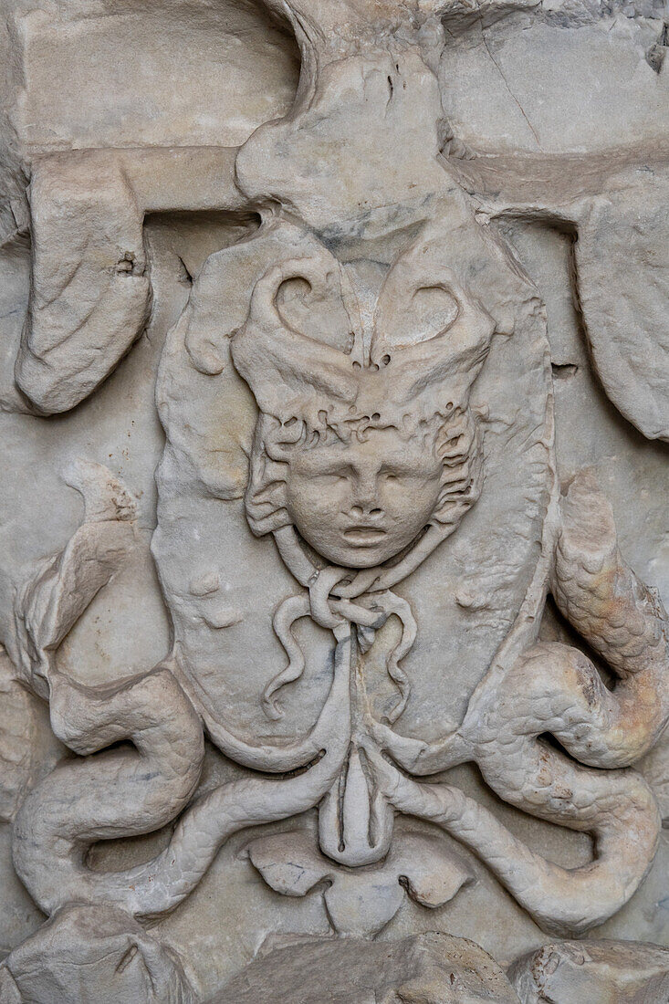 Figured Corinithian capital with a Gorgon originally from Attica, Greece in the Colosseum. Rome, Italy. Used as decoration in the top level of the Colosseum.