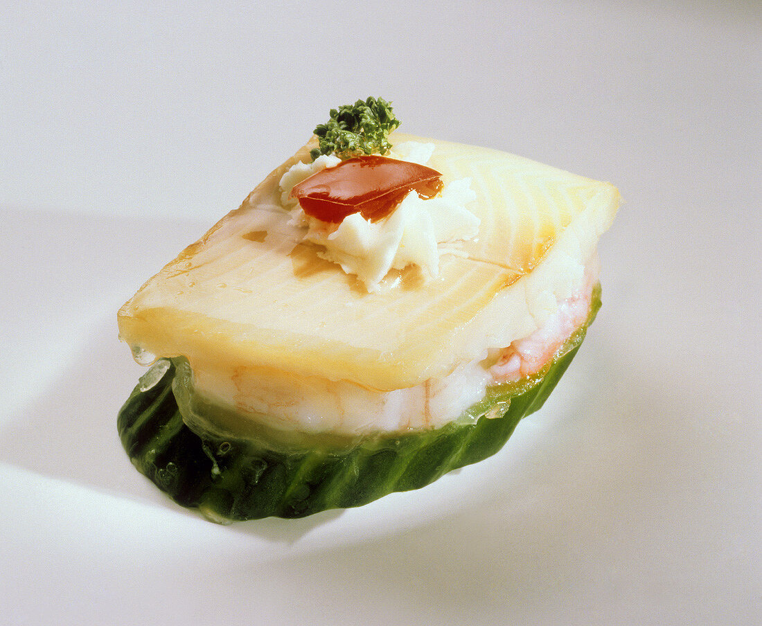Cucumber canapes with shrimps and trout fillet in aspic