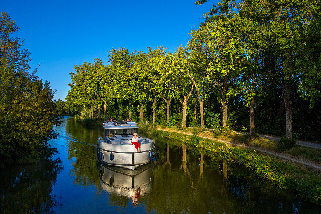 Aerial view of a nice landscape in the Canal du Midi near L'écluse de Marseillette South of France southern waterway waterways holidaymakers queue for a boat trip on the river, France, Europe