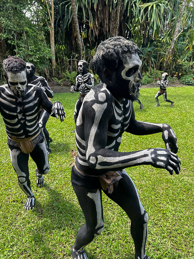 The Skeleton Men from the Omo Bugamo tribe of Papua New Guinea paint their bodies with black and white paint emulating the human skeleton, Chimbu Province, Papua New Guinea