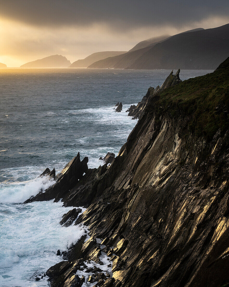 Cliffs of Coumeenoole Beach at sunset, Dingle Peninsula, County Kerry, Munster, Republic of Ireland