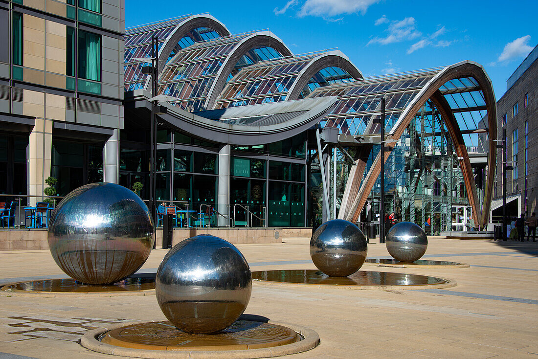 Steel Balls, with Winter Gardens behind, Millenium Square, Heart of the City, Sheffield, Yorkshire, England