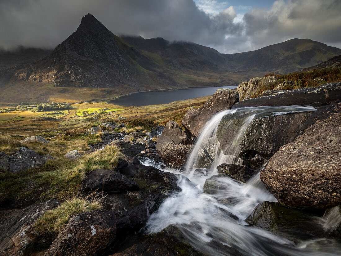 Cascade of Afon Lloer looking towards Tryfan Mountain, Snowdonia National Park (Eryri), Wales, United Kingdom