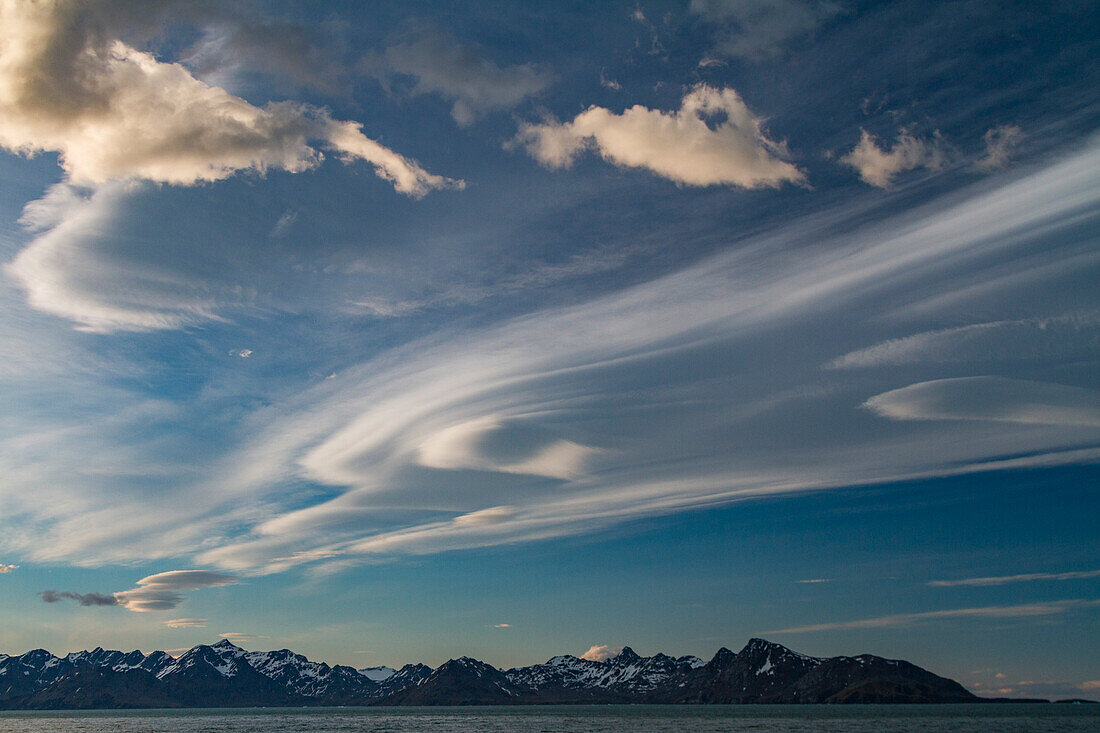 Interesting lenticular cloud formations forming over the island of South Georgia in the Southern Ocean