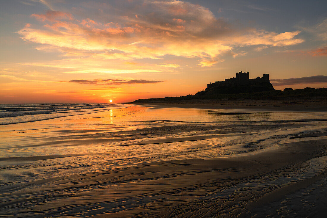 Bamburgh Castle at sunrise, Northumberland, England, United Kingdom