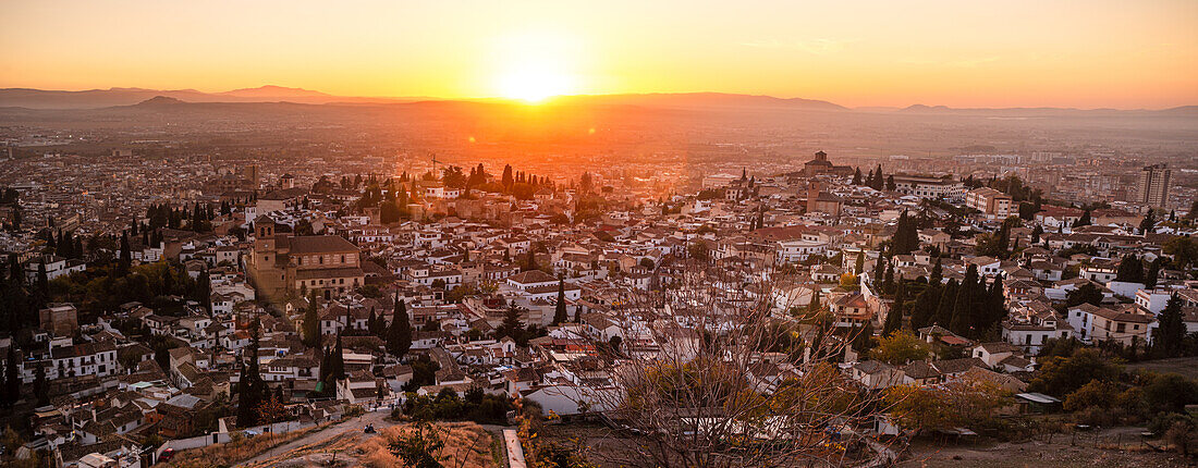 Vibrant red and orange sunset over the Albaicin, UNESCO, Granada, Andalucia, Spain