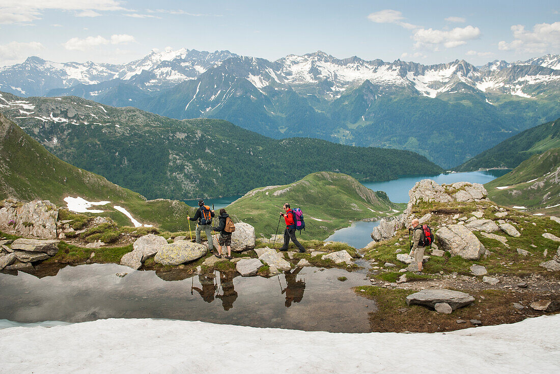 Trekkers above Tom et Ritom lakes, Val Piora, Canton Ticino, Switzerland