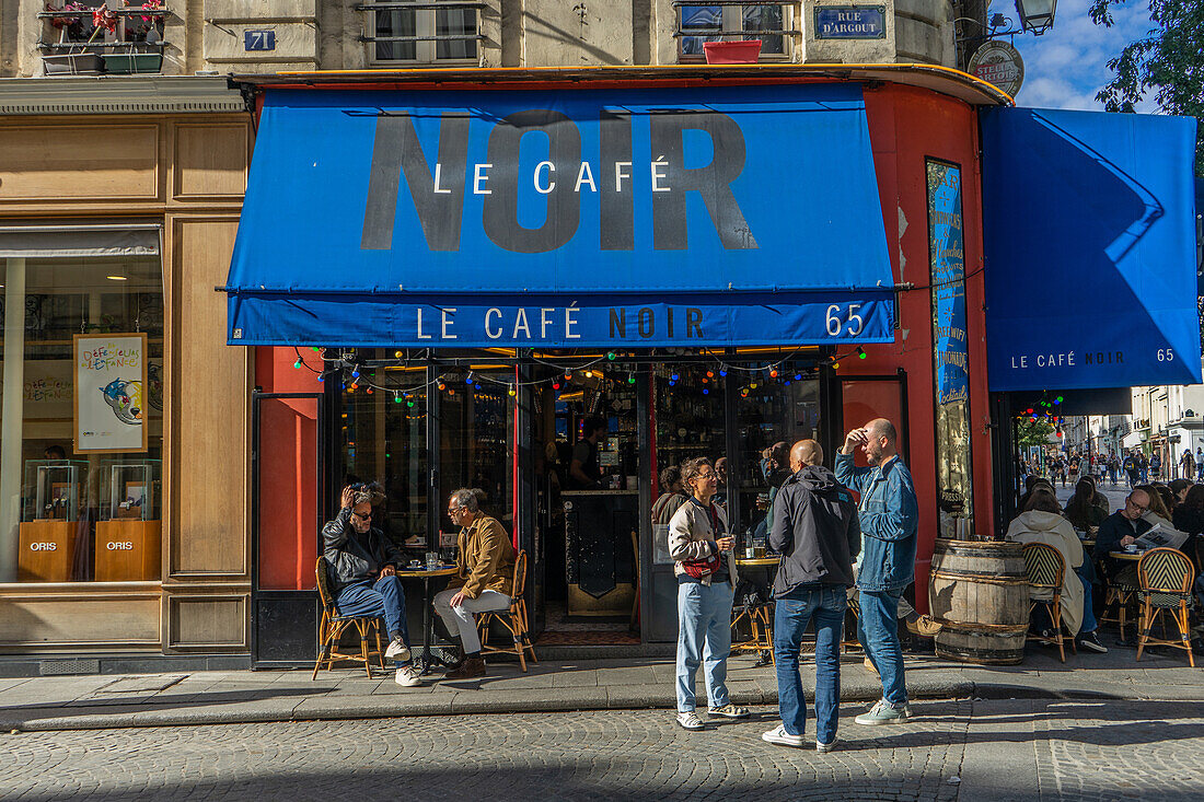 Drinkers outside Le Cafe Noir on Rue Montmartre on a sunny afternoon, Paris, France