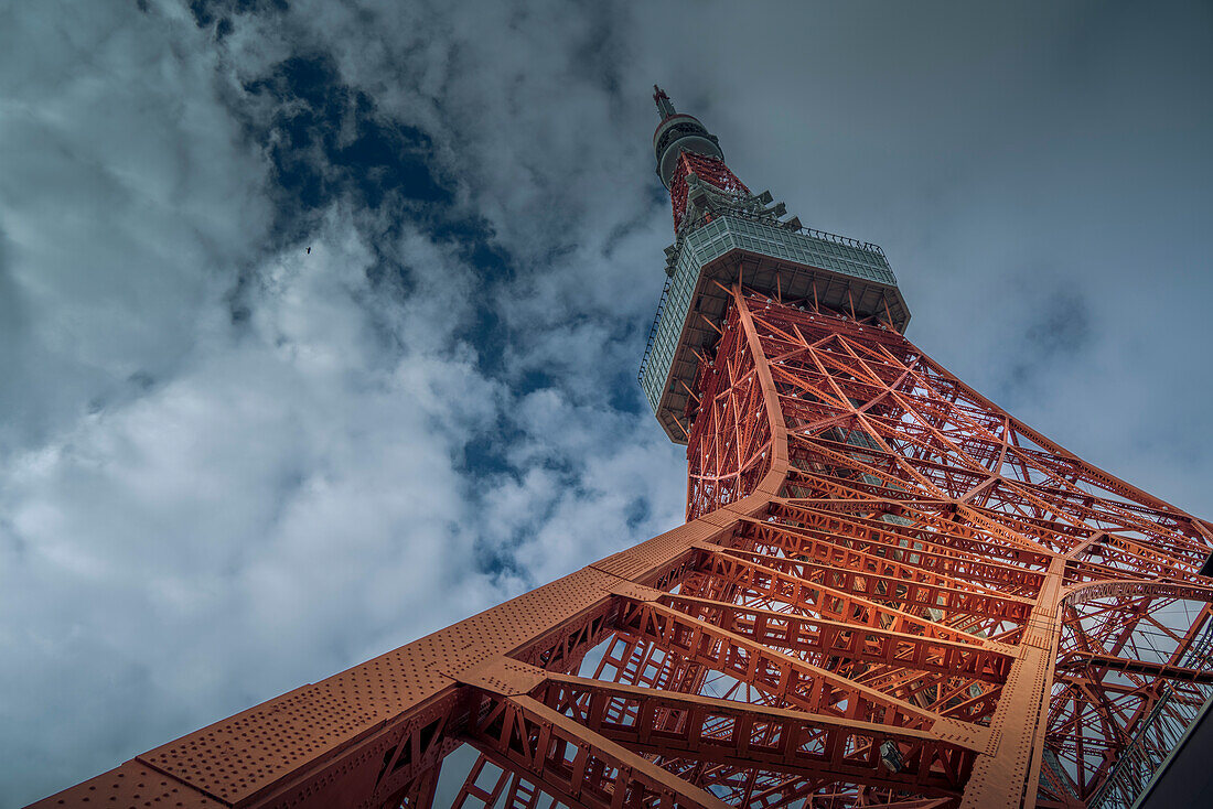 View of Tokyo Tower from its base against cloudy sky, Shibakoen, Minato City, Tokyo, Honshu, Japan