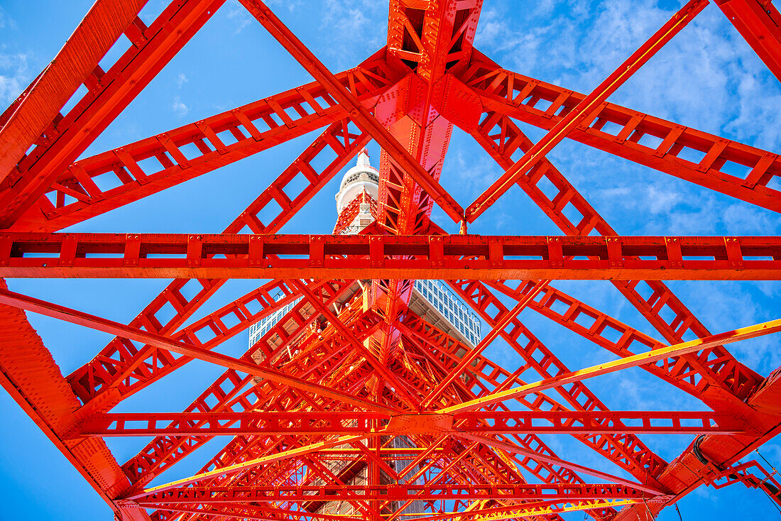 View of Tokyo Tower from its base against blue sky, Shibakoen, Minato City, Tokyo, Honshu, Japan