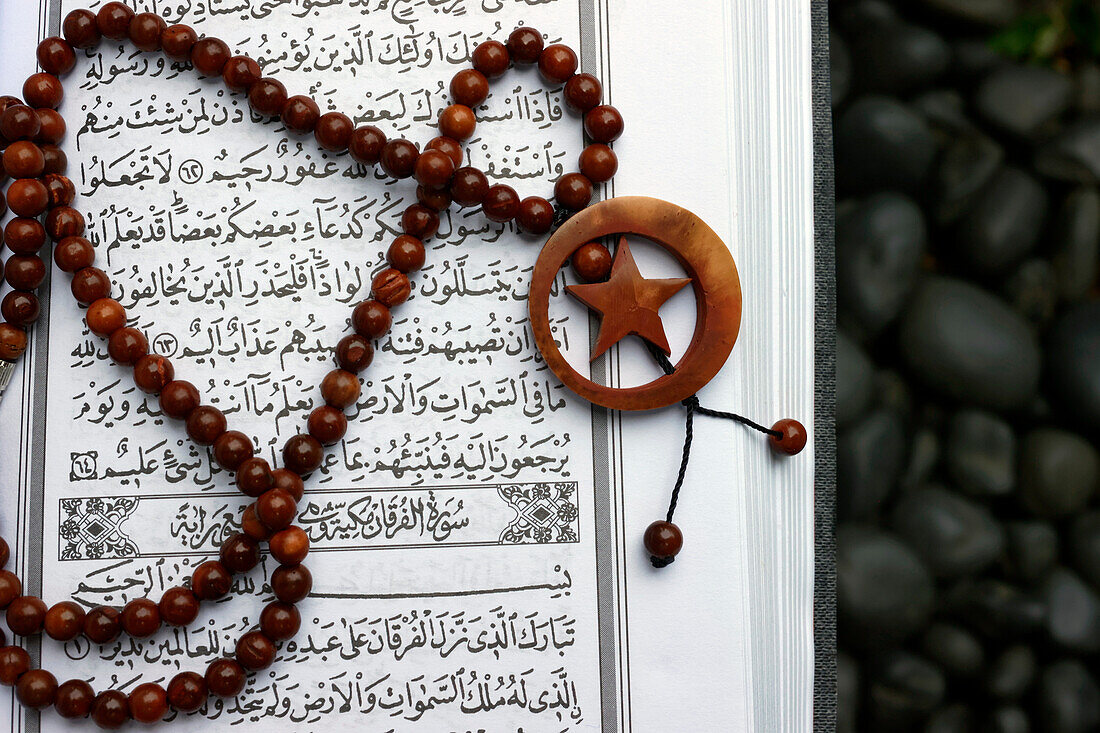 Islamic Holy Book Quran with rosary beads, Ramadan concept, Indonesia