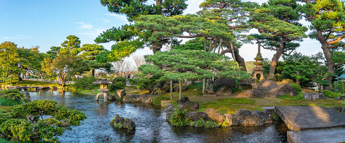 View of Japanese stone lantern and pagoda in Kenrokumachi Japanese Garden, Kanazawa City, Ishikawa Prefecture, Honshu, Japan