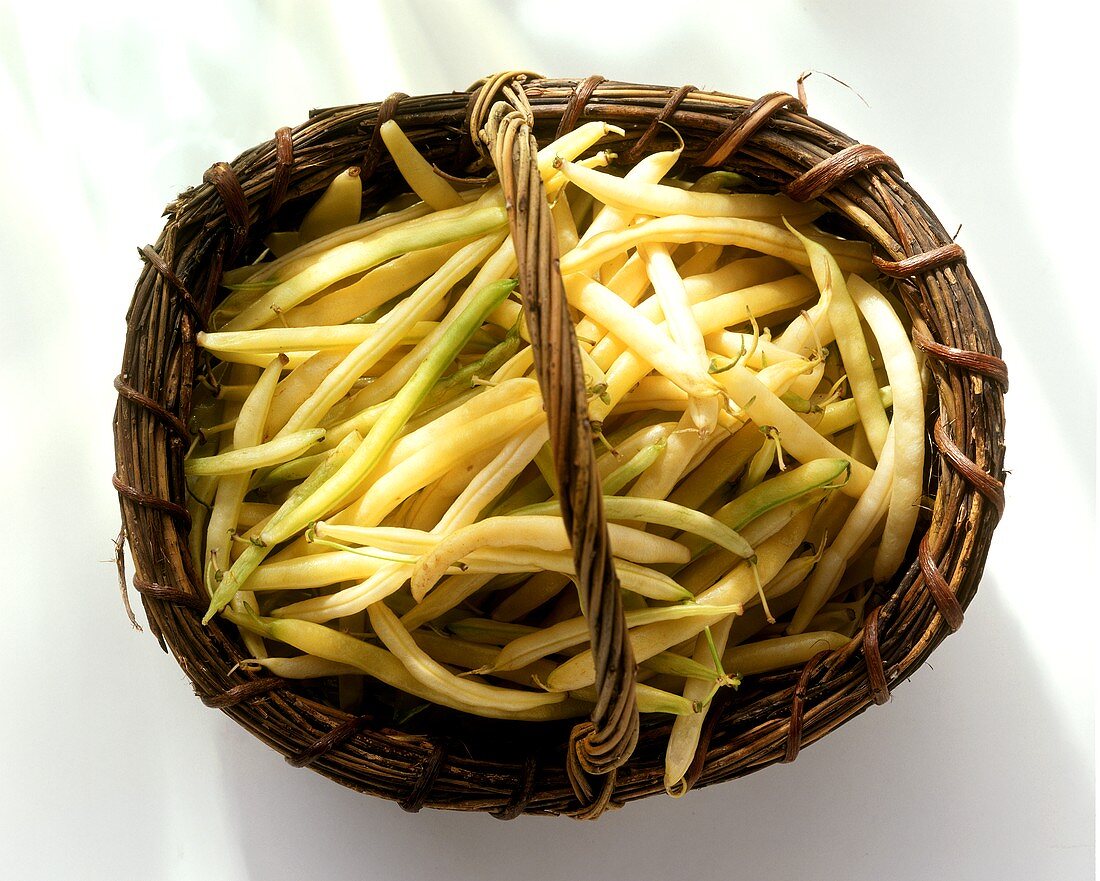 Yellow wax beans in wicker basket