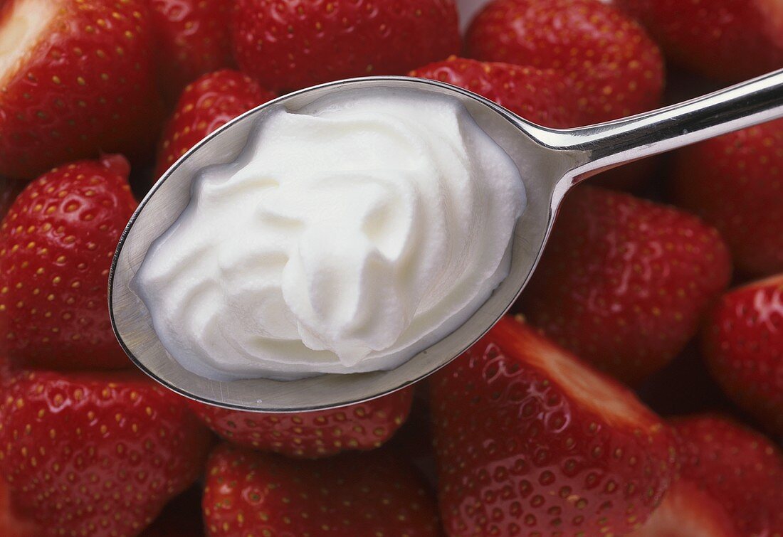 Cut Strawberries with a Spoonful of Cream
