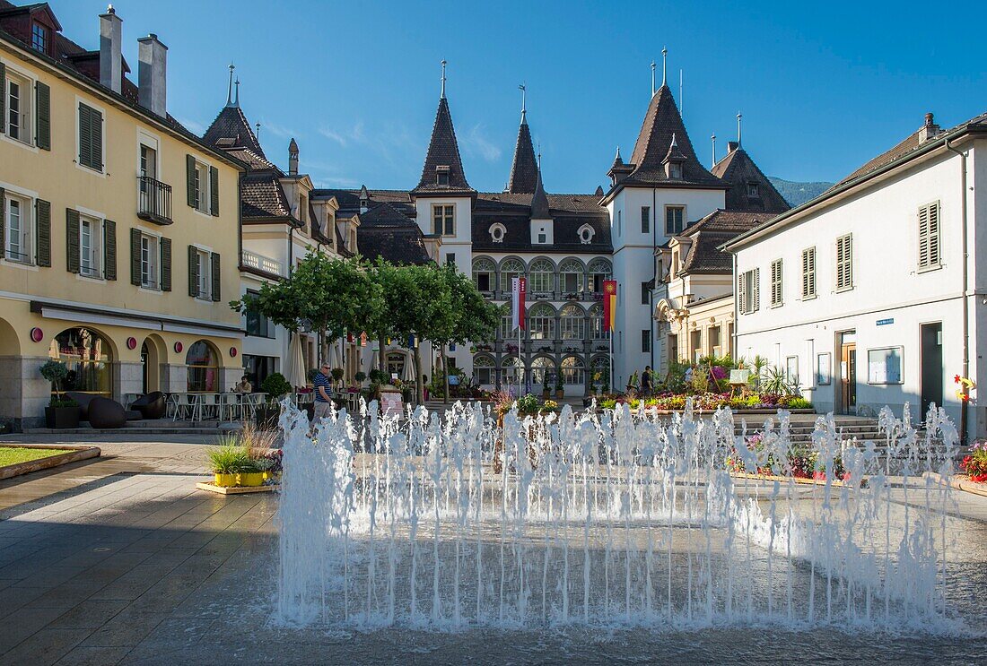 Switzerland, Valais, Sierre, jets of water on the place of the city hall