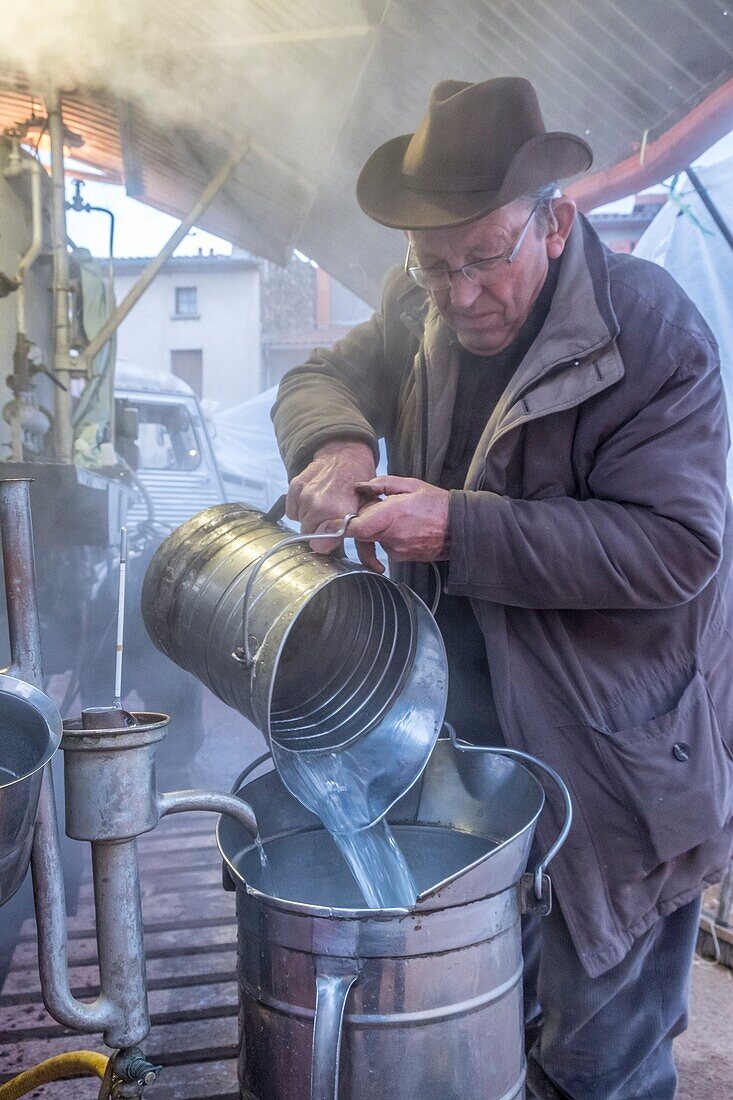 France, Puy de Dome, village of Chas, distiller on the village square