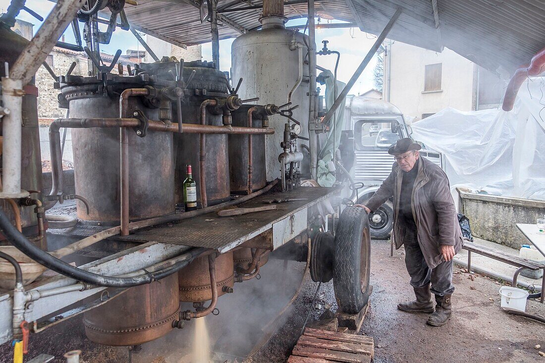 France, Puy de Dome, village of Chas, distiller on the village square