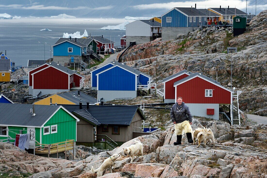 Greenland, west coast, Uummannaq, the sled dog breeder Malti Suulutsun wearing bear skin trousers