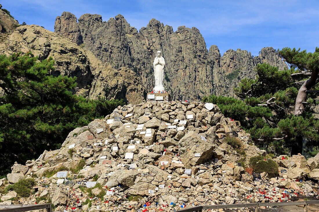 France, Corse du Sud, Quenza, Col de Bavella, Our Lady of the Snow, white virgin of Alta Rocca, Needles of Bavella in the background