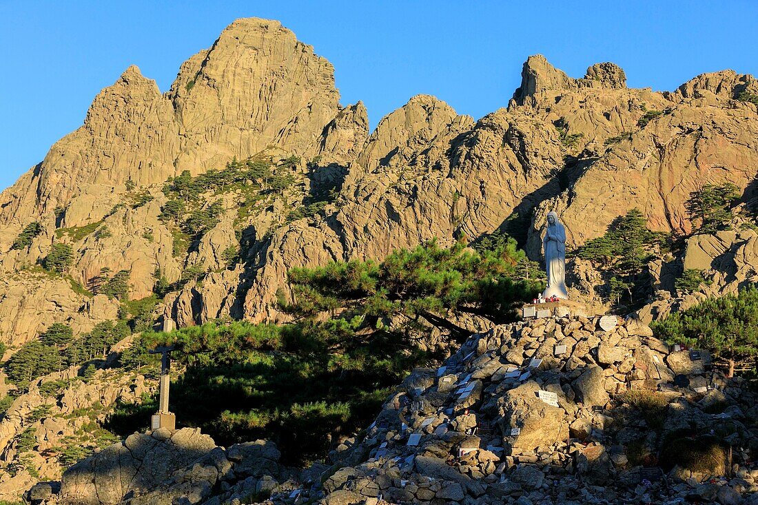 France, Corse du Sud, Quenza, Col de Bavella, Our Lady of the Snow, white virgin of Alta Rocca, Needles of Bavella in the background