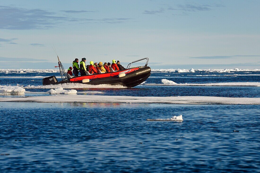 Greenland, North West coast, Smith sound north of Baffin Bay, broken pieces of Arctic sea ice and an exploration PolarCirkel boat (zodiac) of the MS Fram cruse ship from Hurtigruten