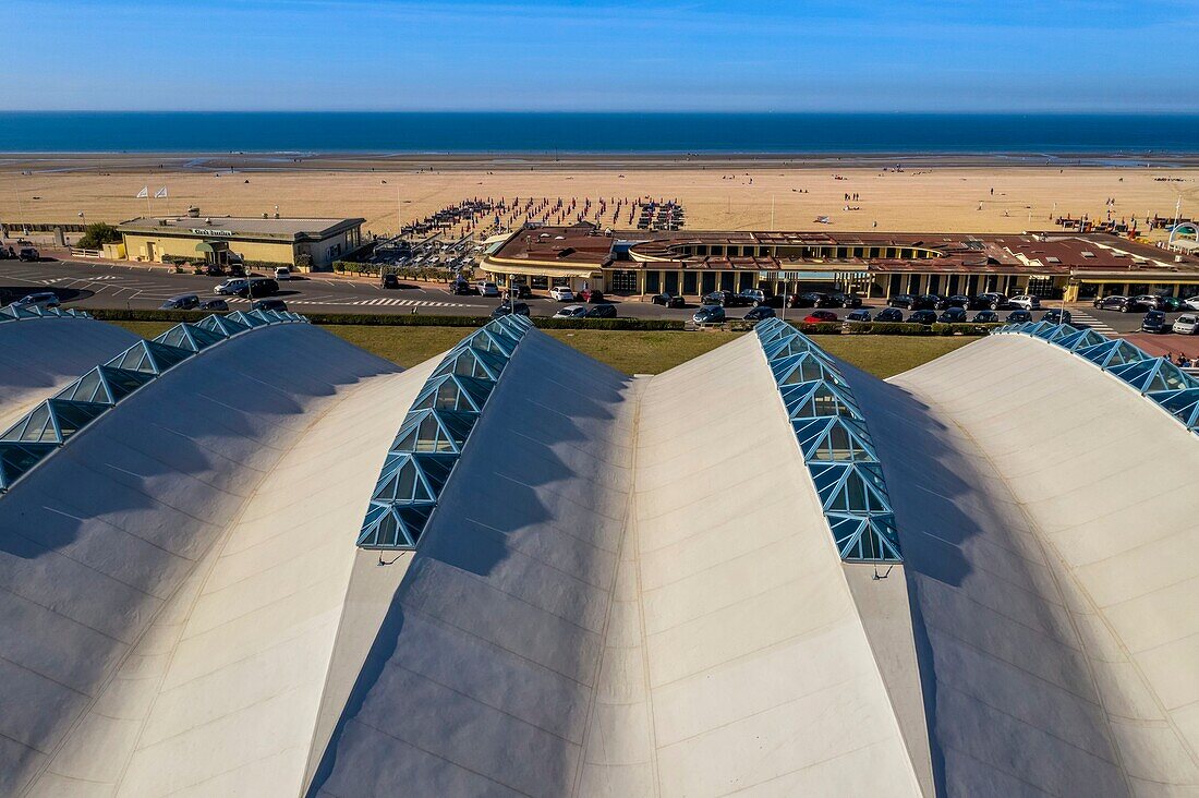 France, Calvados, Pays d'Auge, Deauville, Olympic swimming pool by architect Roger Taillibert and Art Deco style bathing cabins in the background