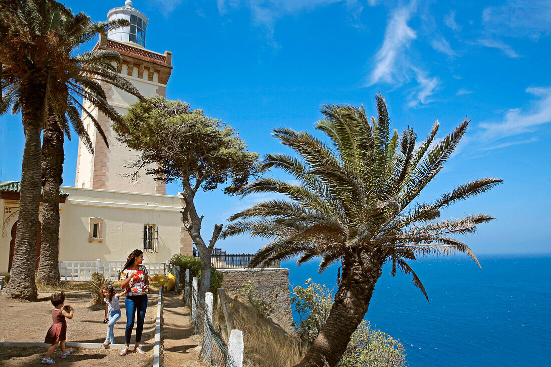 Morocco, Tangier Tetouan region, Tangier, Moroccan woman and her children at the foot of the cape spartel lighthouse overlooking the Mediterranean